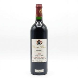 Eine Flasche Château Montus Madiran Cuvée Préstige 1996 mit sichtbarer 75cl-Angabe und Wappenetikett.